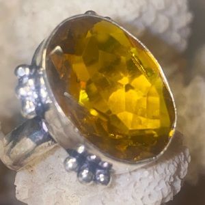 Yellow Citrine faceted cut stone set in a 925 ss ring setting